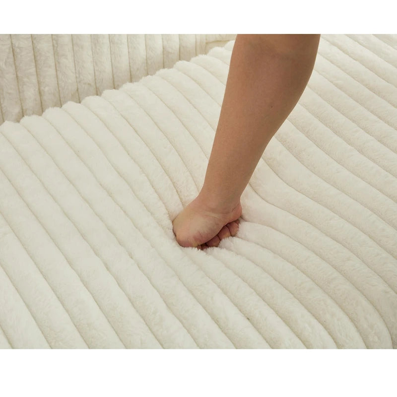Chaise longue surdimensionnée en velours côtelé beige avec pouf