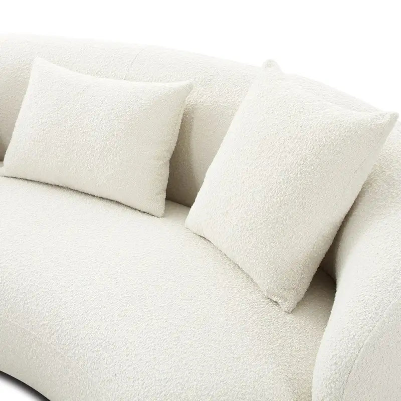 Canapé en tissu incurvé avec coussins fixes et coussins décoratifs
